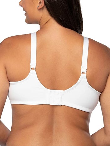 Back of model in white bra