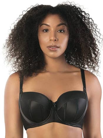 Model wearing black balconette bra
