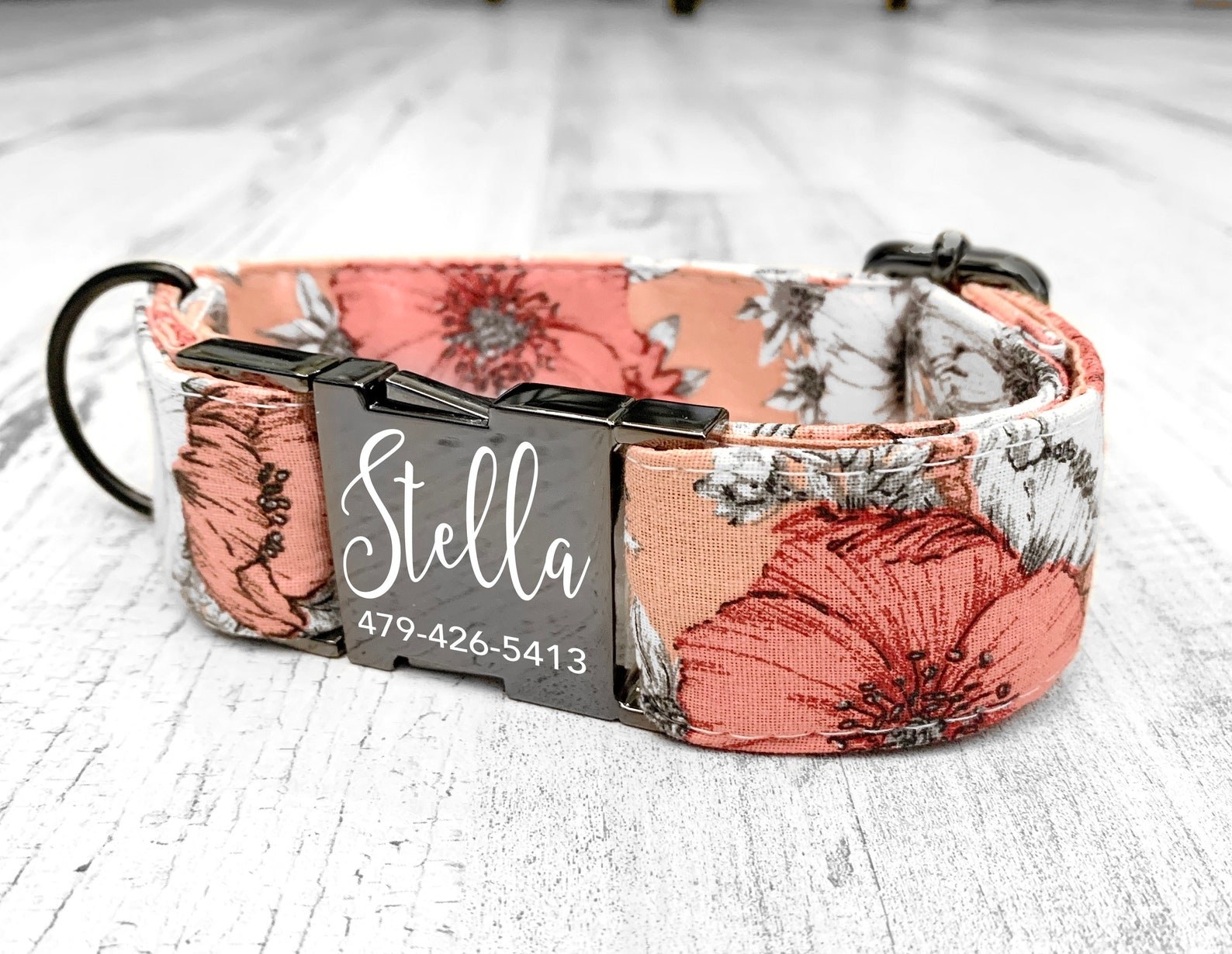 A floral dog collar with an engraved buckle.
