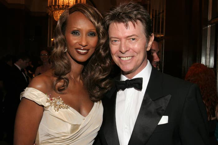Iman and David smiling for a photo at an event