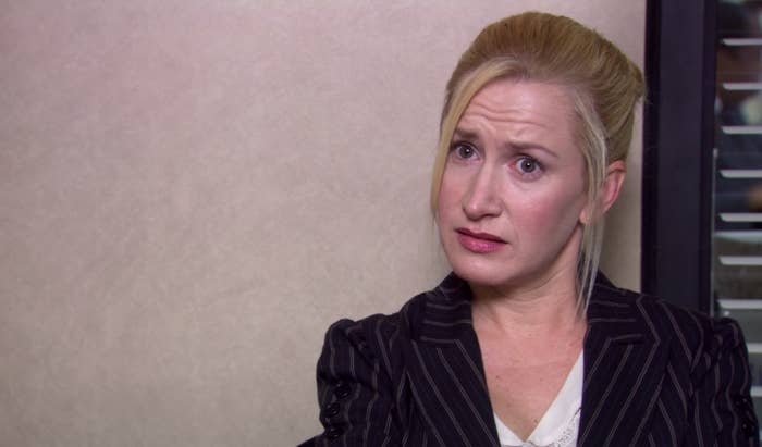 woman with eyebrows raised and scrunched as if confused