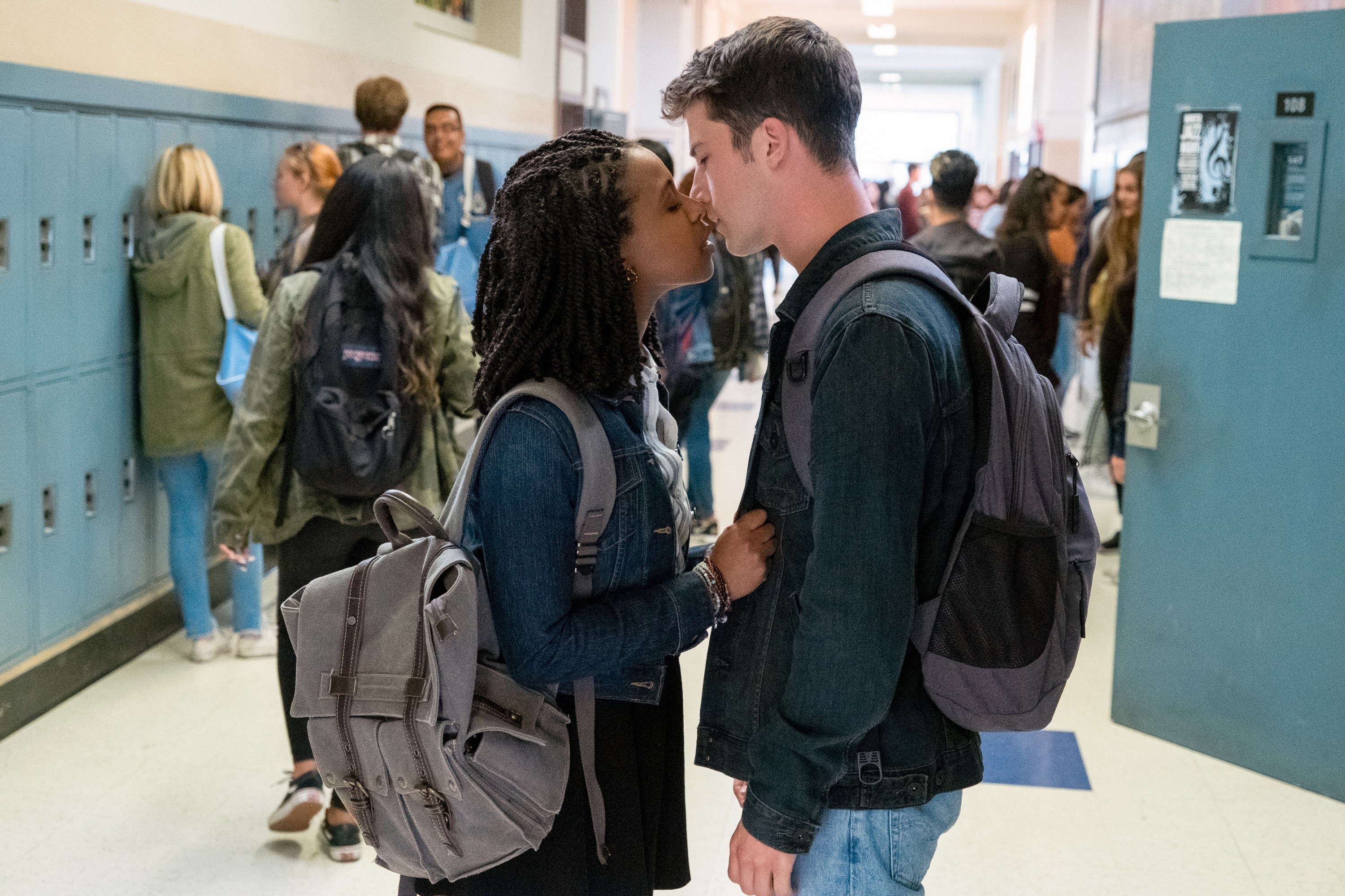 Ani and Clay kissing in the school hallway