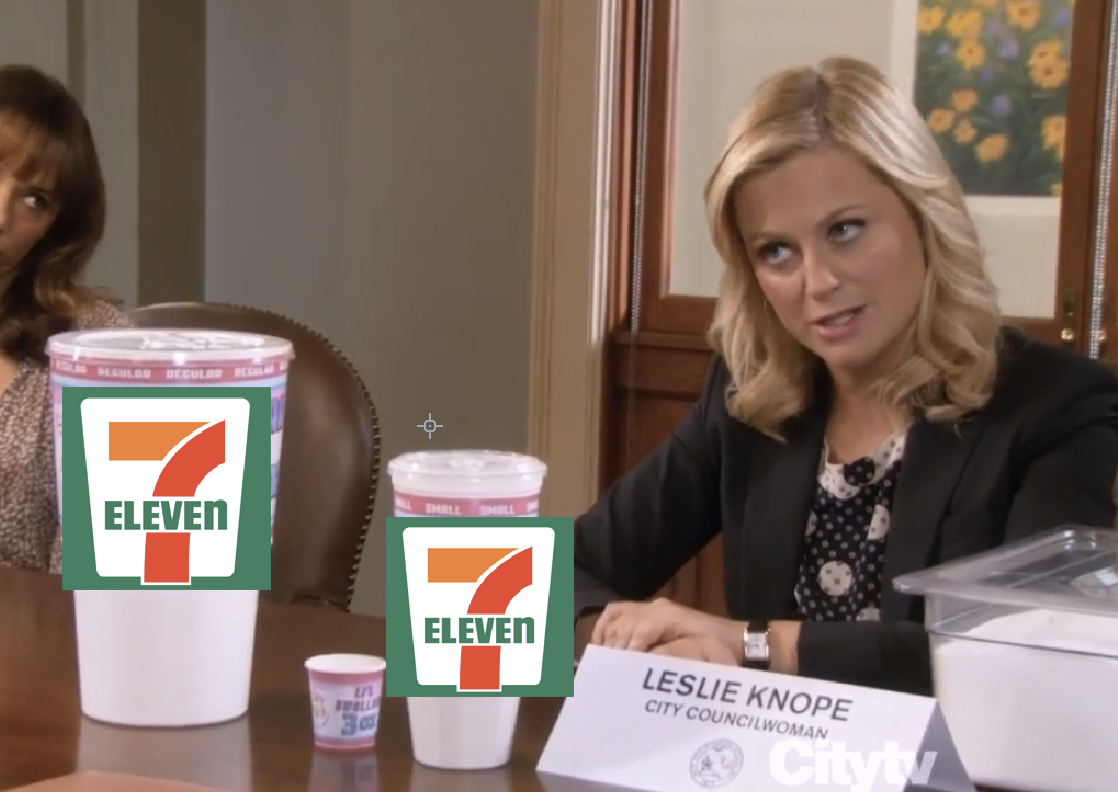 two large cups with 7-11 logos next to leslie knope from parks and rec