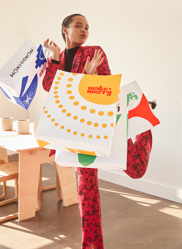 woman carrying nordstrom shopping bags