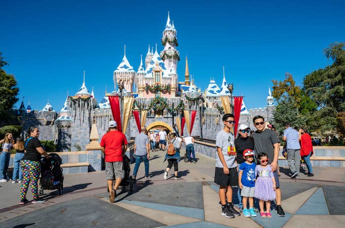 Families walk around Disneyland