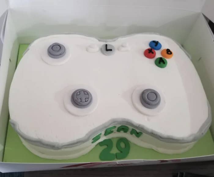 Cake was supposed to look like a white PlayStation console and just looks like a misshapen white blob with weird little round things stuck on top