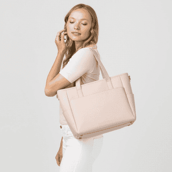 a gif of a model wearing the bag as a shoulder tote, crossbody, and backpack