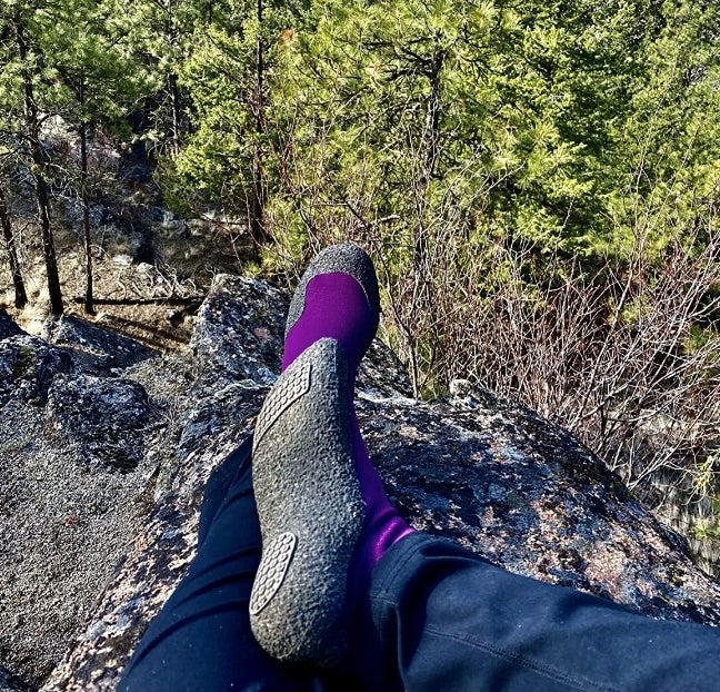 reviewer wearing the sock shoes while hiking
