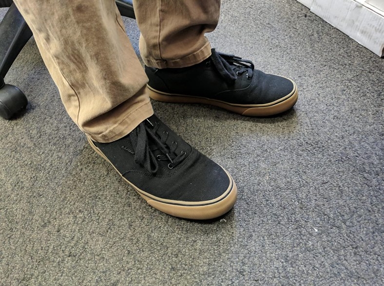 Reviewer wearing black canvas sneaker with beige sole