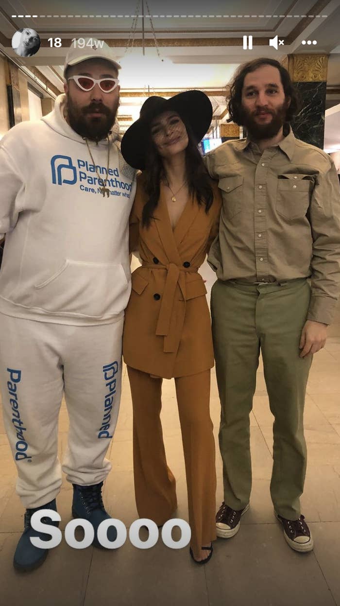Emily wearing her pantsuit while standing next to friends at the courthouse