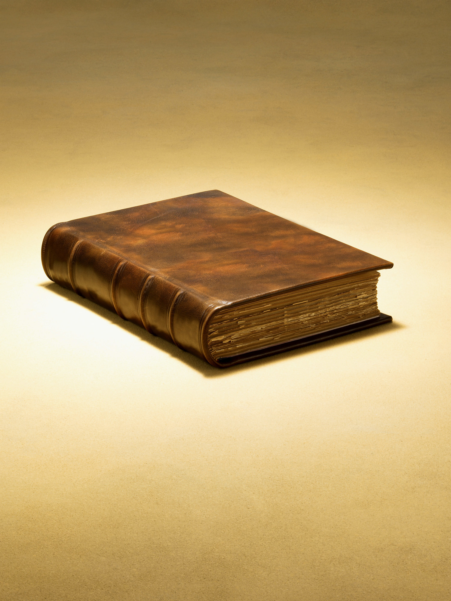 An old, weathered book with a brown hardcover