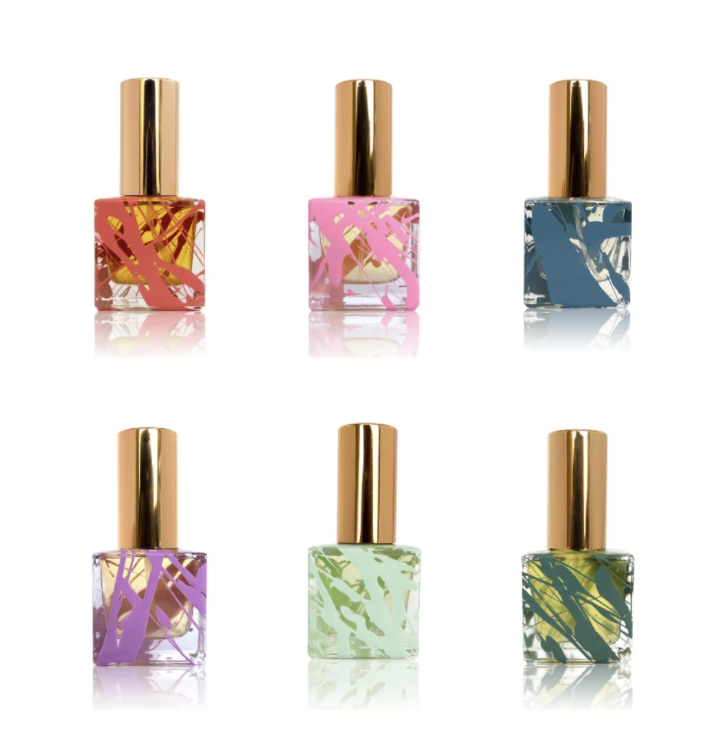 Six perfume bottles in various colors