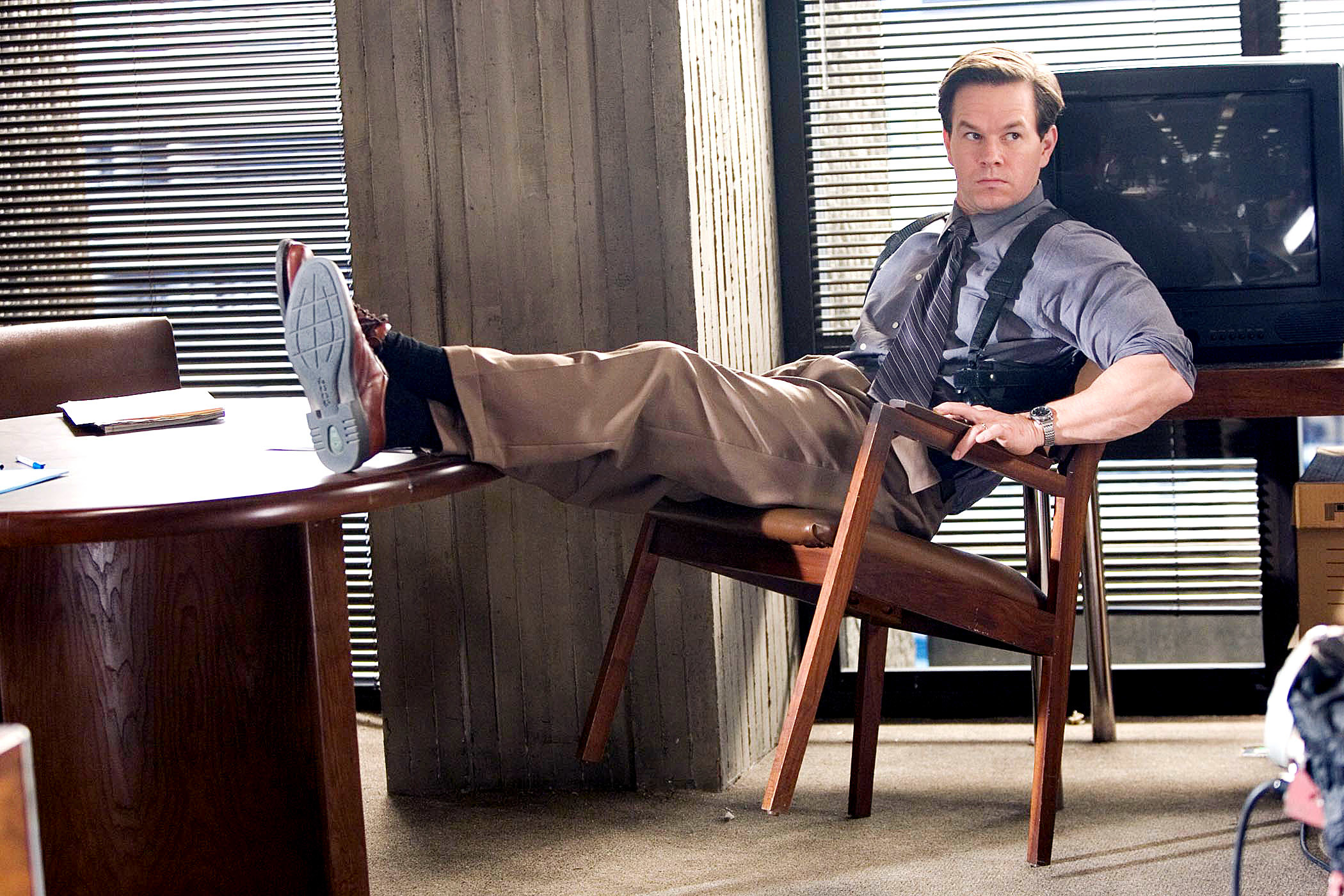 Mark Wahlberg leans back in a chair