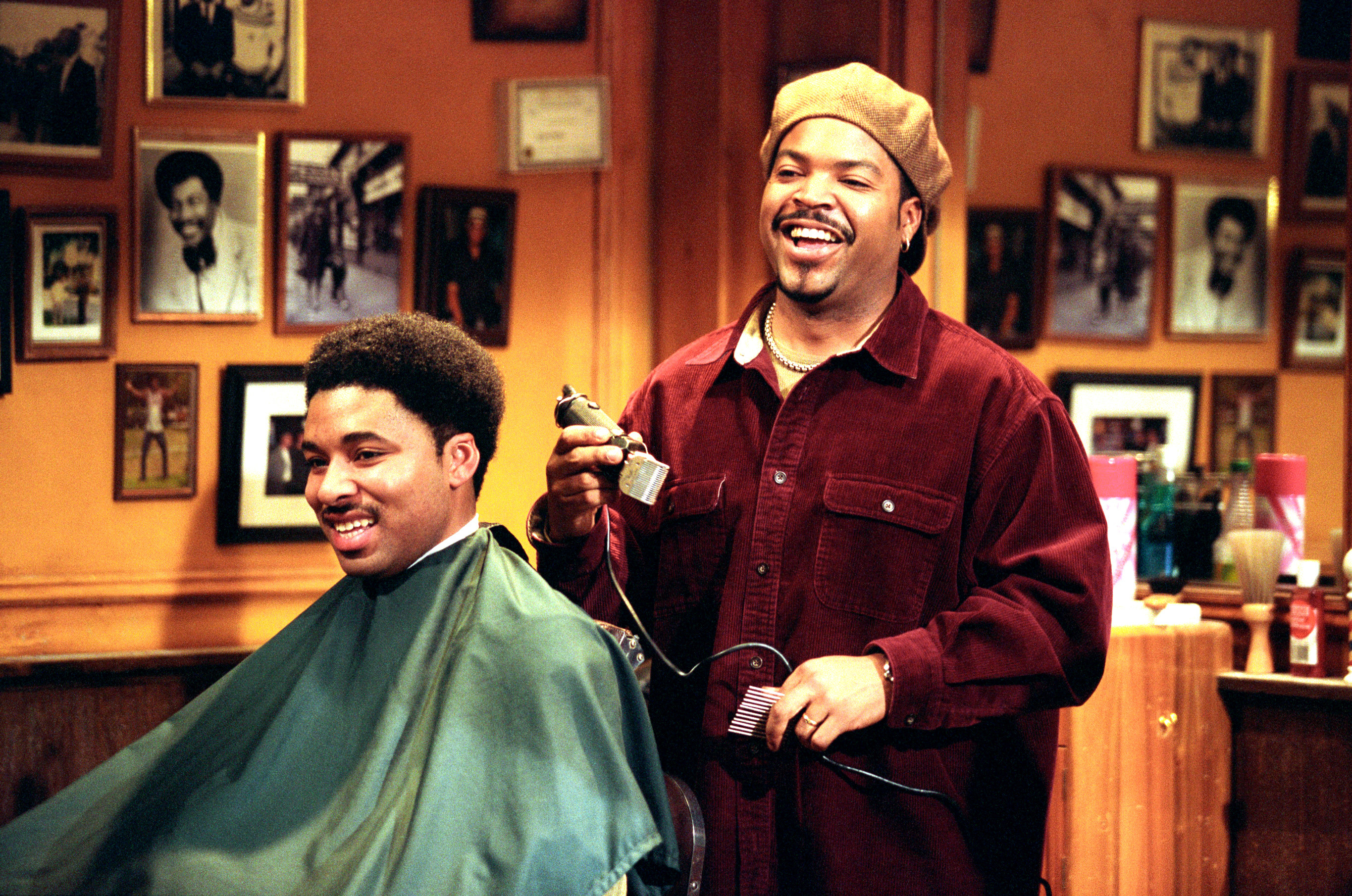 Ice Cube stands in a barber shop cutting hair