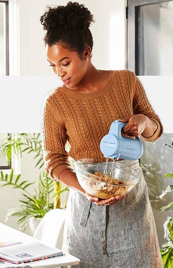 Model using the blue hand mixer to mix a bowl of cookie dough