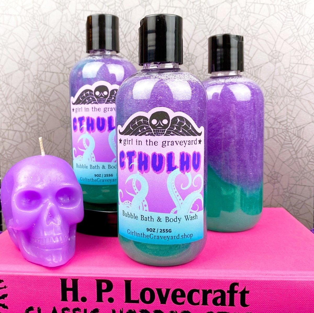 Three bottles of purple and green bubble bath and body wash that say &quot;Cthulhu&quot; on the label