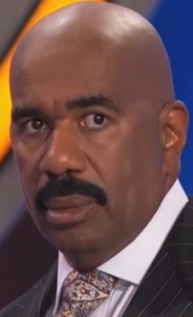 Harvey on &quot;Family Feud,&quot; staring off in a confused manner