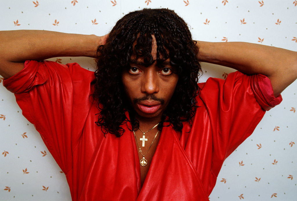 James in a portrait session wearing a deep-neck red shirt