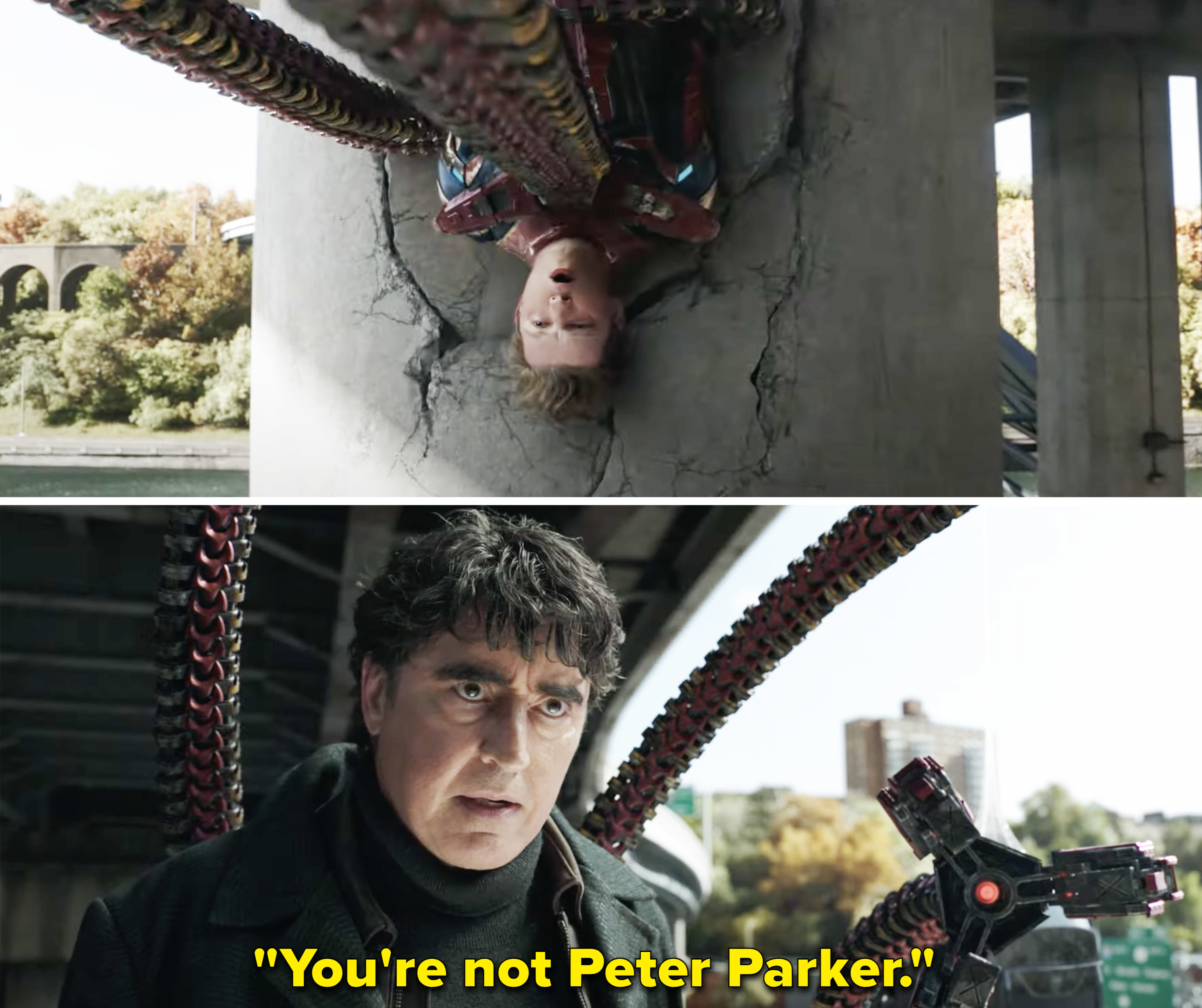 Doc Ock looks at Tom Holland&#x27;s Peter who he has pinned against a column on an overpass