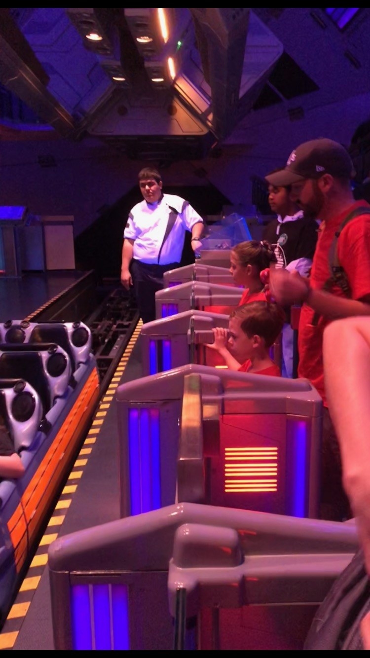 the space mountain line with plastic barriers
