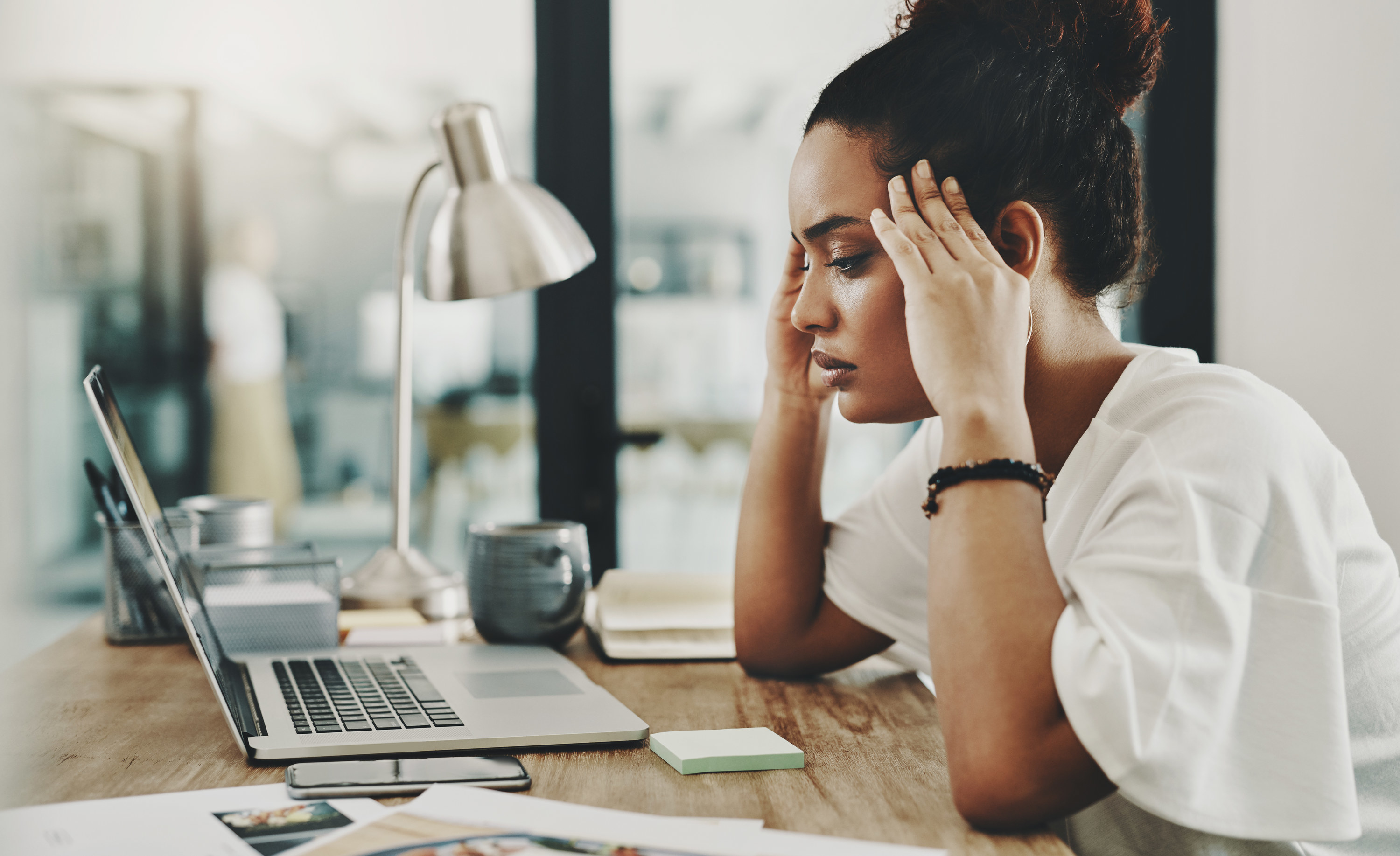 Woman feeling stressed at work
