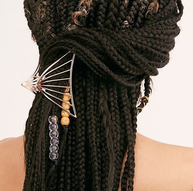 model with triangular metal claw clip in their hair