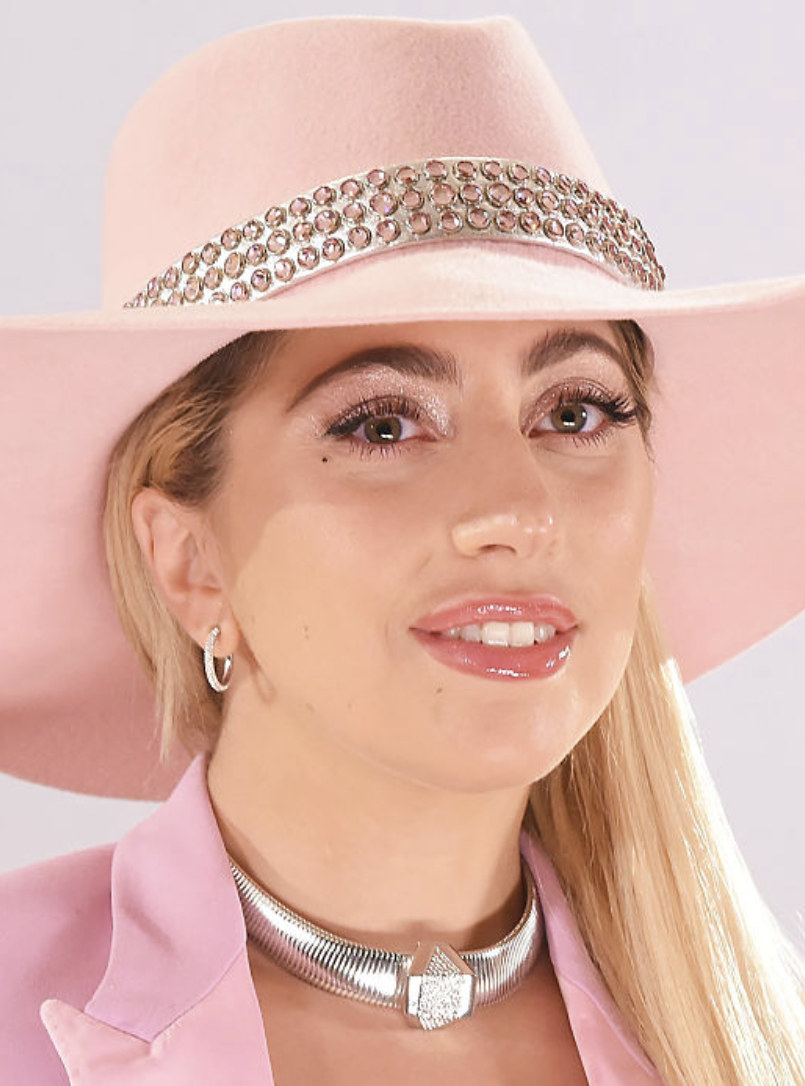 Gaga wearing a bright cowboy hat and matching jacket