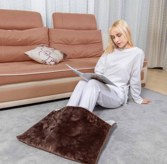 a model using the brown foot warmer
