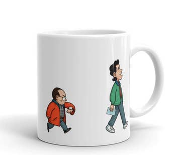 first side of mug with george looking at watch and jerry walking and smiling