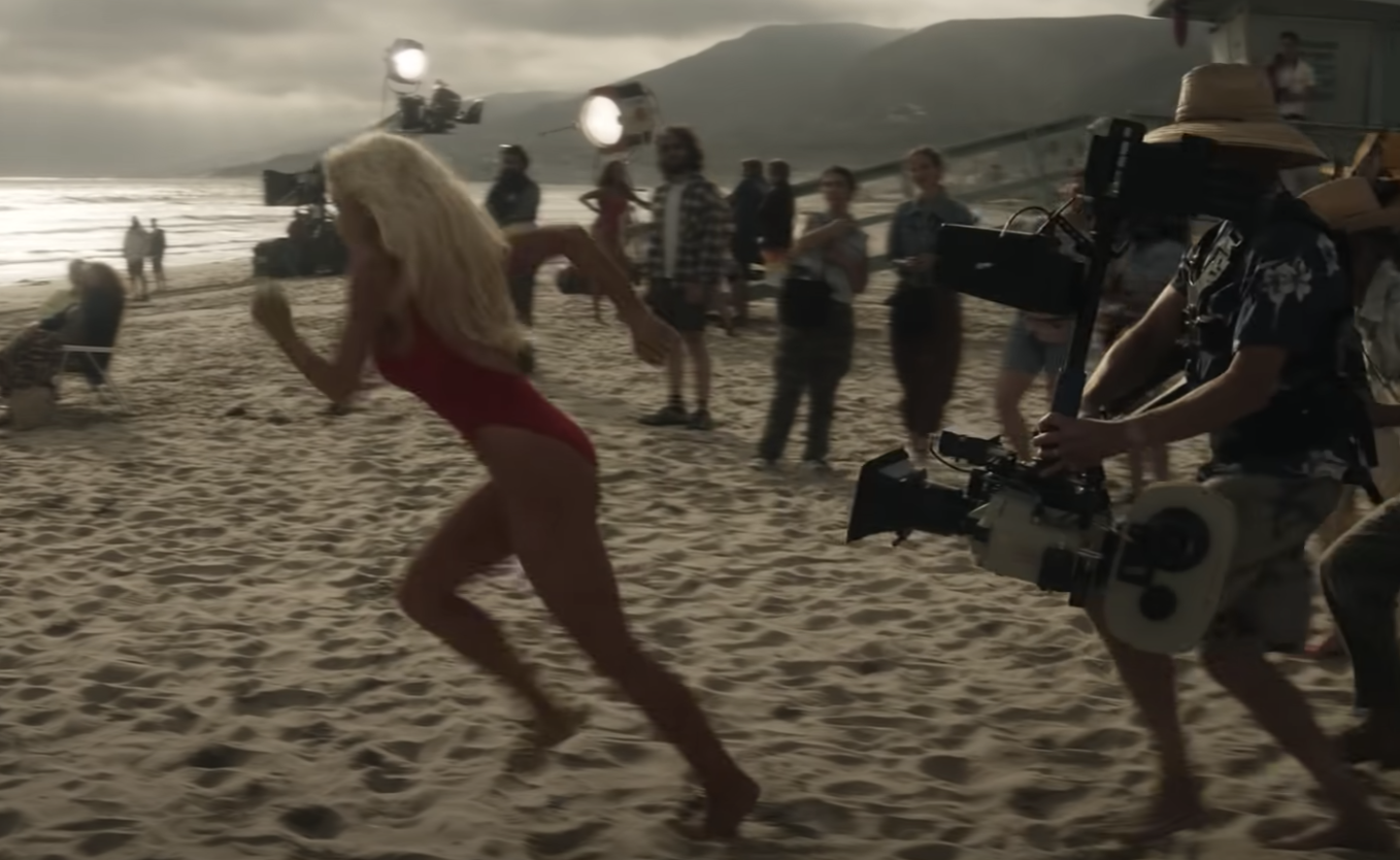 Lilly running on the beach as she films a scene