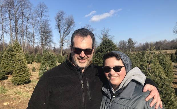 Picture of the commenter and another person at a Christmas tree farm