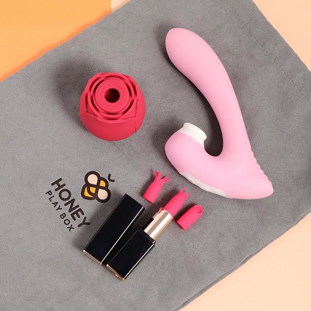 Red rose-shaped vibrator, pink G-spot vibrator and black and pink lipstick vibrator