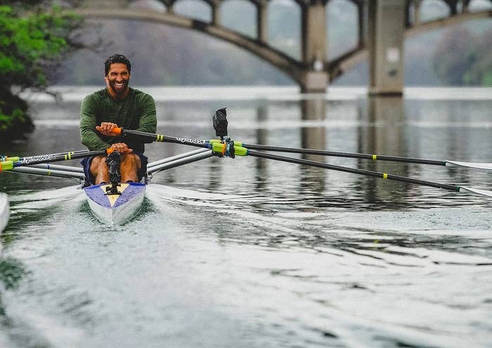 A person rowing on a river.