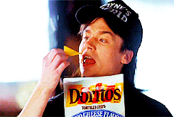 Man eats a Dorito chip