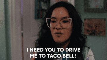 Woman in glasses asks to go to Taco Bell