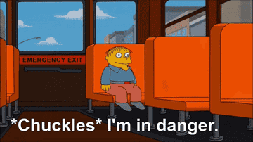 gif of character from the simpsons sitting on a bus and saying i&#x27;m in danger while chuckling