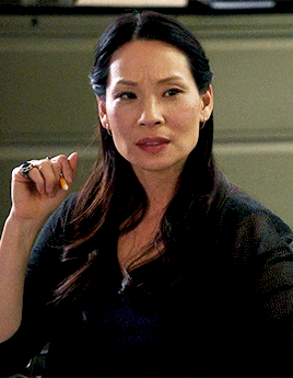 Lucy Liu blinking and looking confused