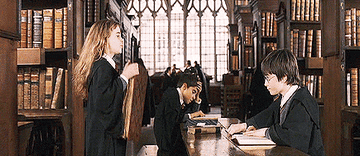 Hermione dropping a book