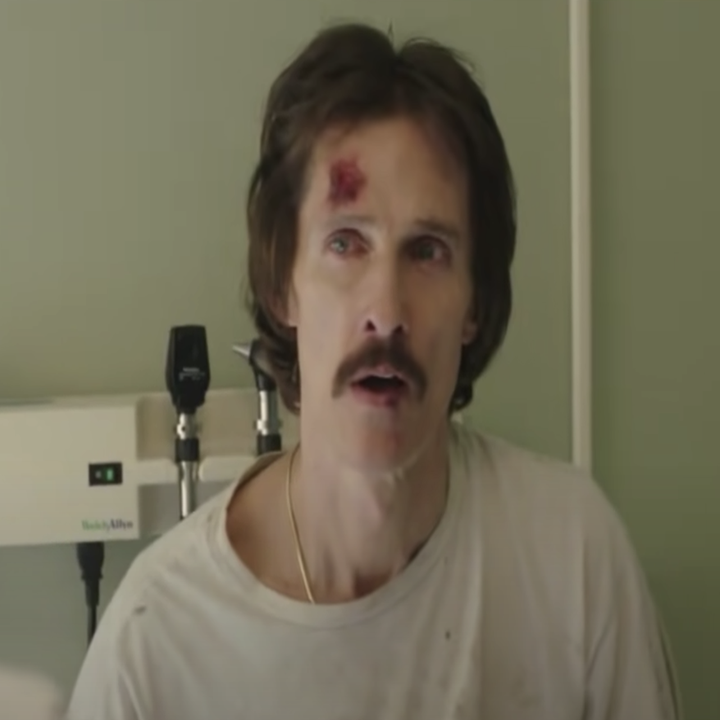 A sickly-looking Matthew in a hospital room with a red sore on his forehead