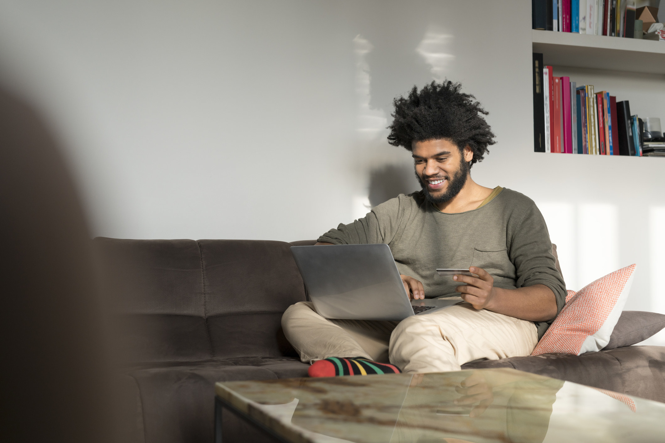 A man on the couch with his laptop