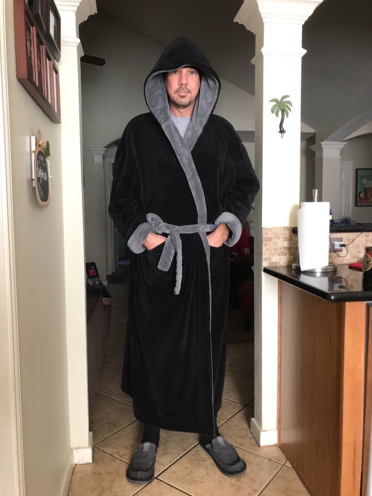 reviewer wearing the robe in black with gray lining