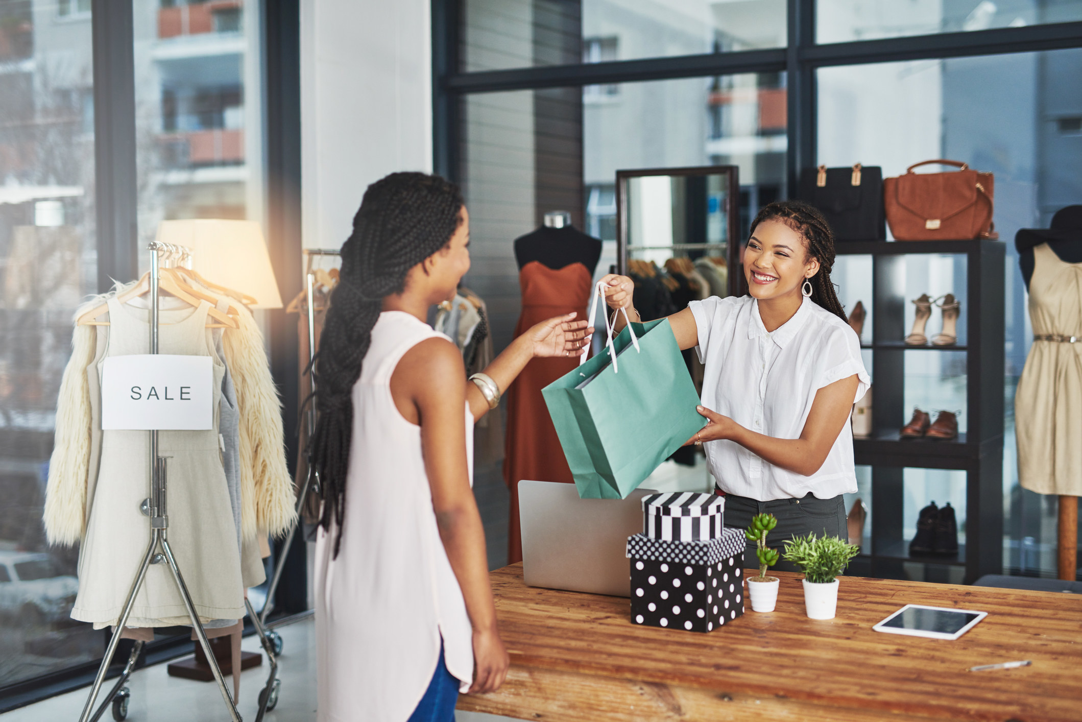 A person receiving her newly bought item