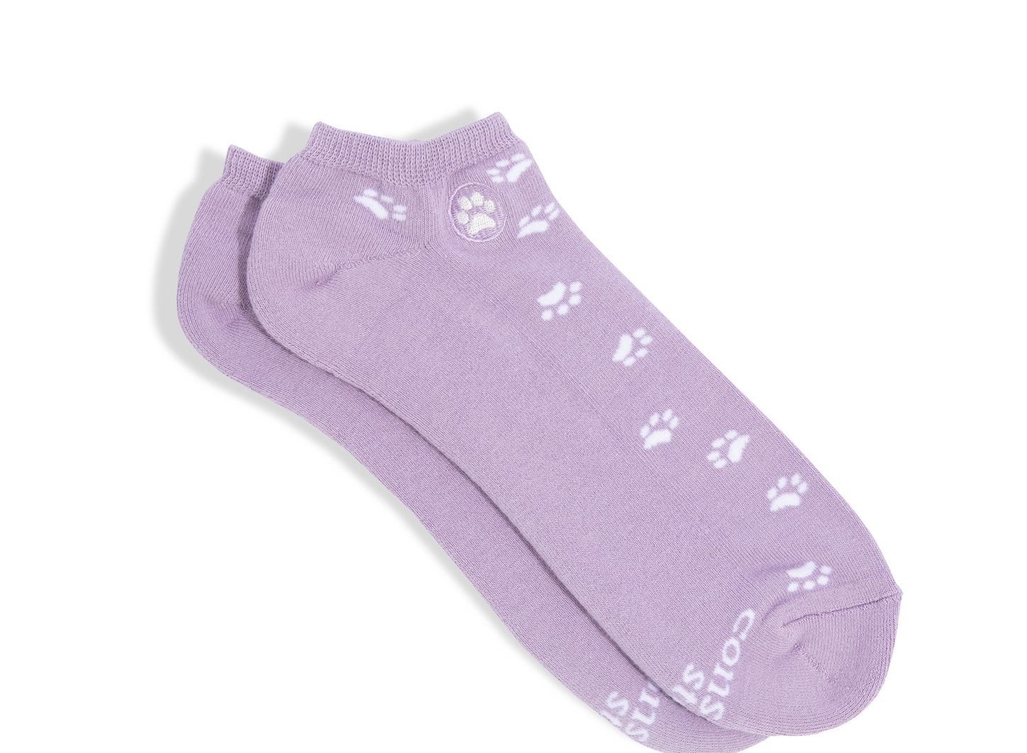 A pair of purple ankle socks with dog paws on them
