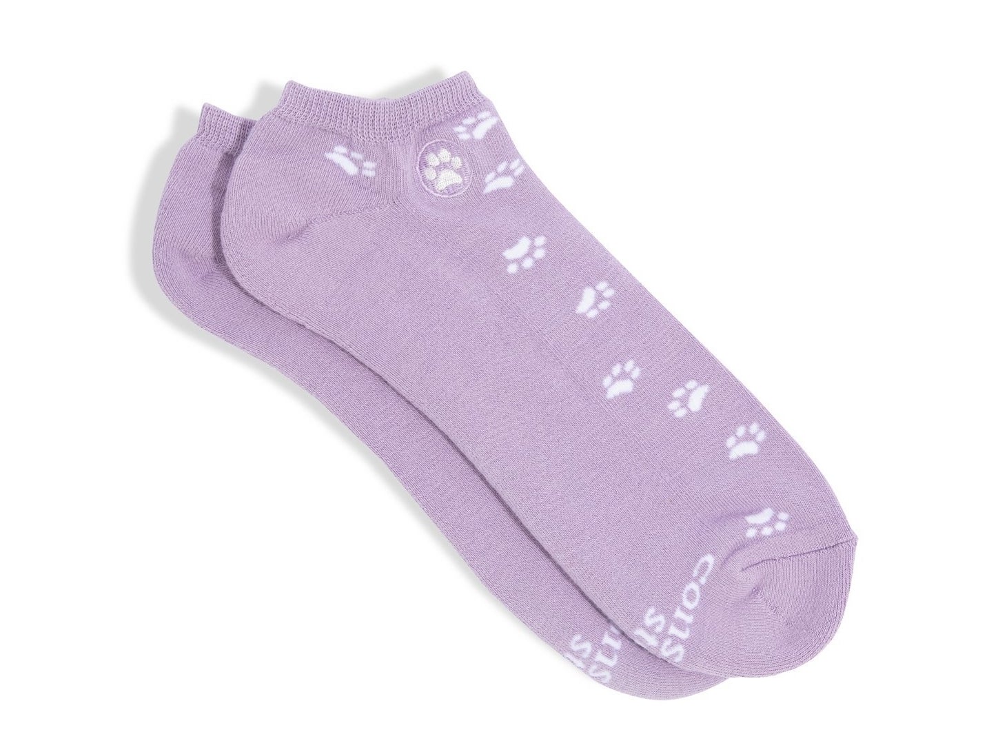 A pair of purple ankle socks with dog paws on them