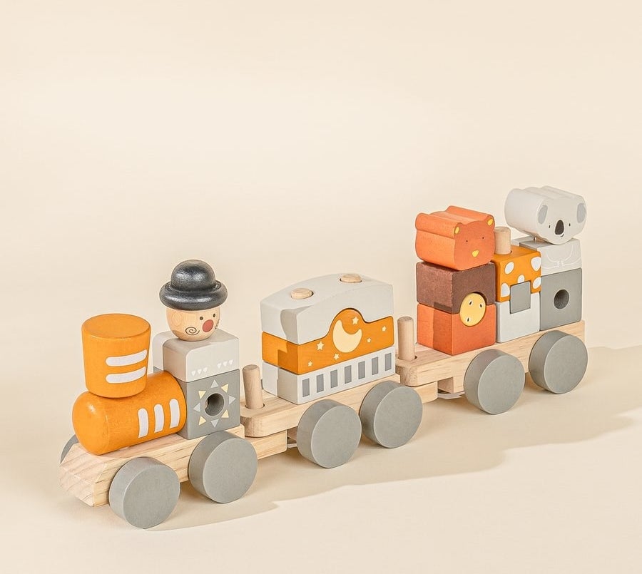 an orange and gray circus-themed train block set