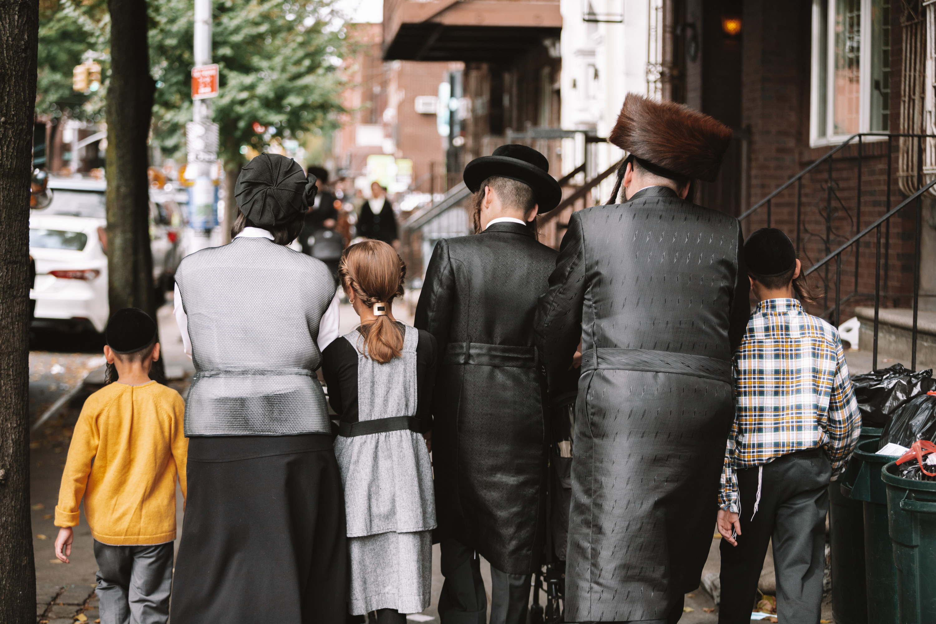 Photo of a Jewish family walking in Brooklyn