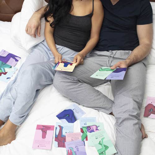 Couple surrounded by Mystery Vibe position cards