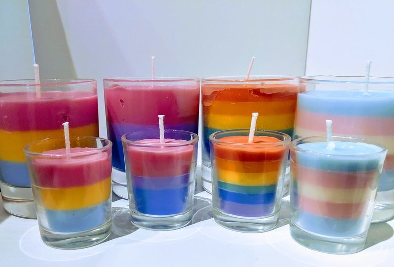 pansexual, bisexual, rainbow, and trans pride colored candles in two sizes