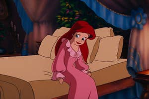 Ariel from The Little Mermaid sitting on a bed in Prince Eric's castle