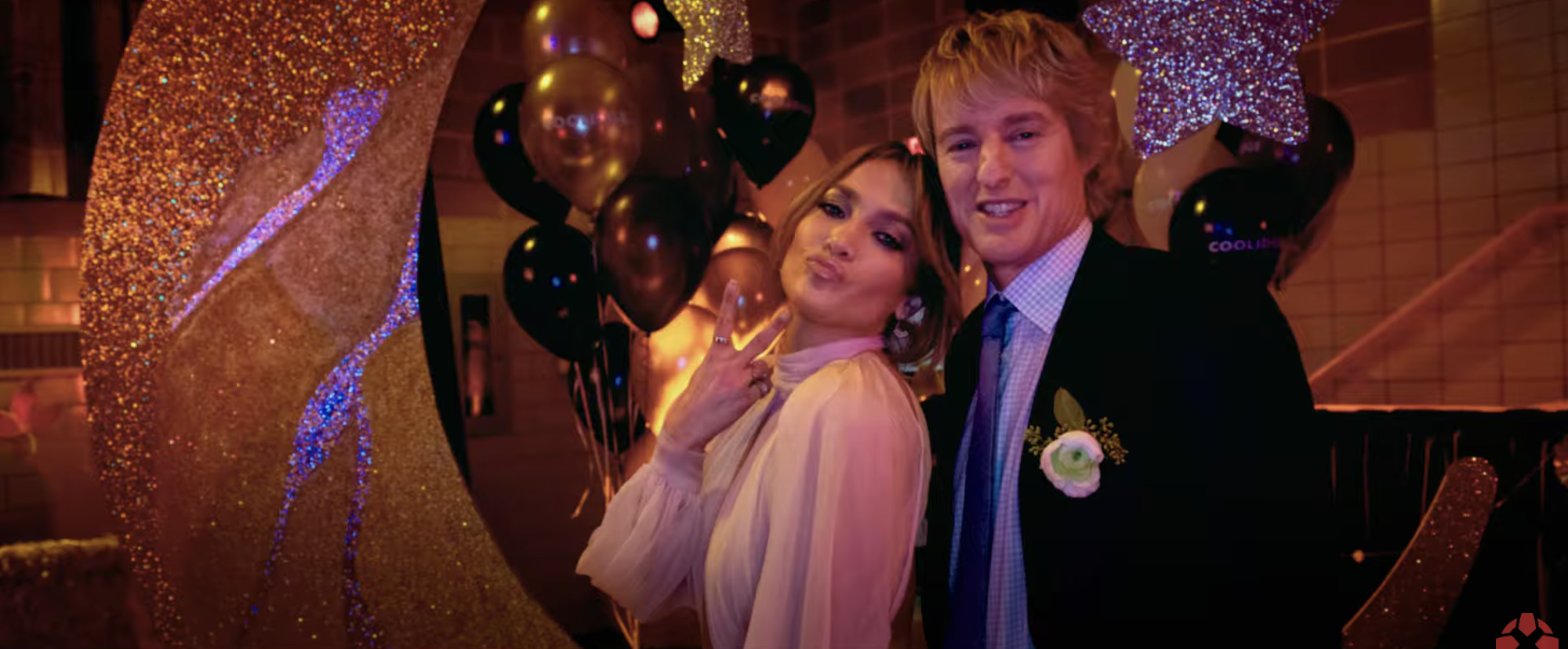 Kat and Charlie posing for a photo at the school dance